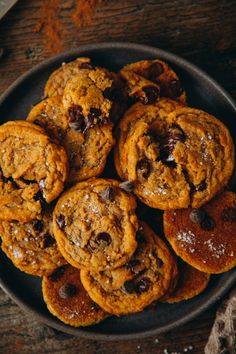 chocolate chip cookies in a black bowl on a wooden table