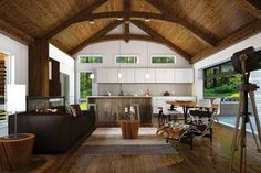 a living room filled with furniture and a wooden ceiling