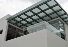 a white building with a glass roof on top