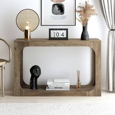 a table with some books and vases on it