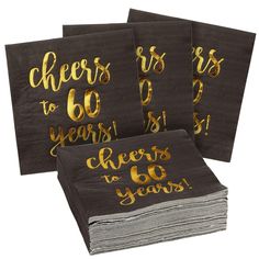 four napkins with gold foil on them and the words cheers to 60 years printed on them