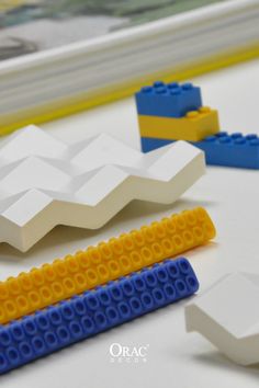 some legos are laying on the table with different shapes and sizes to make them look like they're made out of legos