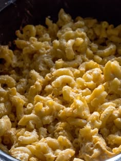 macaroni and cheese is cooking in a pot