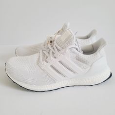 a white adidas running shoe on a white background