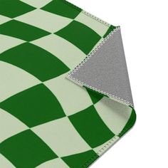 the green and white checkered fabric is folded up