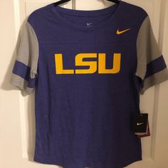 Never Worn Nike Lsu Shirt. Size M! Nike Purple Crew Neck T-shirt, Nike Purple Sporty Tops, Purple Nike Sporty Top, Nike Purple Tops For Spring, Nike Sporty Purple Top, Purple Graphic Print Top For College, Purple Letter Print Shirt For Spring, Sporty Purple Top With Letter Print, Purple Crew Neck Top For College