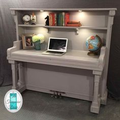 a white desk with a laptop on it