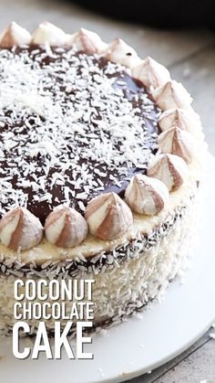 a chocolate cake with coconut toppings on a white plate and the words coconut chocolate cake above it