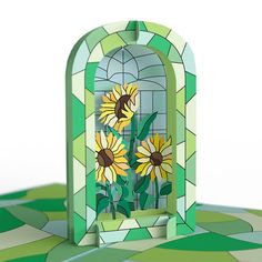 a stained glass window with sunflowers in it on a green and white floor