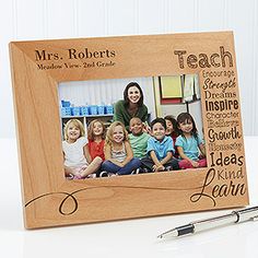 a teacher's photo frame with the words teachers and children on it next to a pen