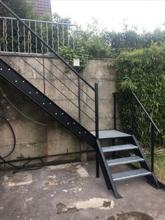 a set of stairs next to a wall