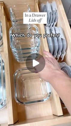 a drawer filled with empty glass containers and dishes in it's drawers, which do you prefer?