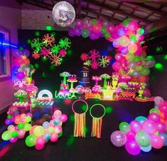 a room filled with lots of balloons and decorations