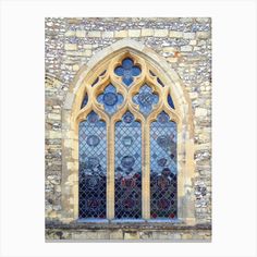 an old church window with stained glass in it