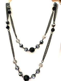 Fashion jewelry extra long blacktone sparkly rhodium plated black and clear glass crystal chain station necklace. Black necklace chain is 58" long with a lobster claw closure. The largest glass crystal is approximately 3/8" Free gift bag with jewelry purchase. Crystal Necklace Black, Black Chain Necklace, Crystal Chain, Station Necklace, Black Necklace, Black Chain, Necklace Black, Black Rhodium, Glass Crystal