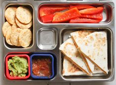 a metal tray filled with different types of food