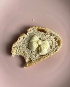 a piece of bread with two pieces of butter on it