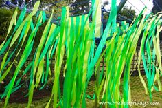 green grass blowing in the wind on a sunny day at an amusement park or theme park