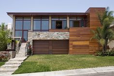 a modern house with wood and stone accents