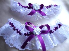 two garters with purple and white ribbons on them