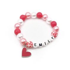 This adorable name bracelet features a hot pink enamel heart charm, heart print beads and 10mm hot pink, pink and white acrylic beads double strung with durable stretch floss cord.  Your bracelet will arrive in an organza bag making it ready to give as a gift.  Please select the size needed from the drop down menu and enter the name you would like on your bracelet in the personalization box.  Please message me if you have any questions.  To be the first to know about new items, sales and giveawa Heart-shaped Name Bracelet For Valentine's Day, Personalized Heart Jewelry, Customizable Heart-shaped Name Bracelet For Valentine's Day, Cheap Pink Heart-shaped Name Bracelet, Valentine's Day Pink Heart-shaped Name Bracelet, Adjustable Pink Heart-shaped Name Bracelet, Valentine Name, Pearl Jewelry Gift, Cardboard Jewelry Boxes