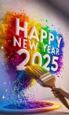 a person holding a paintbrush with the words happy new year on it in front of a colorful background