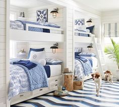 a bed room with bunk beds and pillows on the bottom shelf next to each other