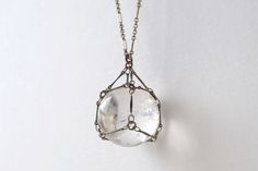 Captive Quartz Crystal Ball Pendant Necklace Quartz Jewelry As A Gift, Quartz Jewelry Gift, Round Quartz Jewelry Gift, Vintage Faceted Crystal Necklaces For Gifts, Mystical Clear Jewelry For Gifts, Clear Mineral Crystal Jewelry For Gifts, Clear Large Stone Jewelry For Gifts, Clear Jewelry With Large Stone As A Gift, Clear Jewelry With Large Stone For Gift