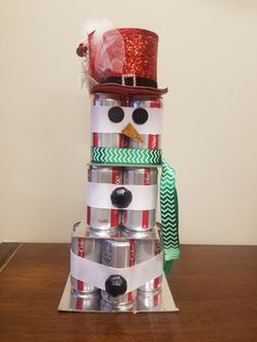 a snowman made out of cans on top of a table