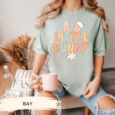 🐇🌸 Little Bunny Easter Shirt - Spring Into the Season! Celebrate Easter with our adorable Little Bunny Easter Shirt, complete with cute bunny ears! This festive tee is perfect for Easter egg hunts, family gatherings, or just embracing the joy of spring. Whether you're looking for matching Easter shirts for a group or a cute Easter tee for yourself, our bunny lover shirt brings a hop of happiness to any occasion. It's a charming way to show your love for these furry friends and the perfect addi Easter Shirts, Easter Bunny Ears, Easter Tees, Shirts Cute, Bunny Lovers, Cute Easter, Bunny Easter, Easter Shirt, Bunny Ears