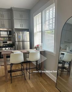 the kitchen is clean and ready to be used as a dining room or living room