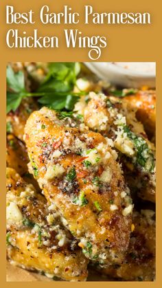 the best garlic parmesan chicken wings recipe is shown on a plate with greens