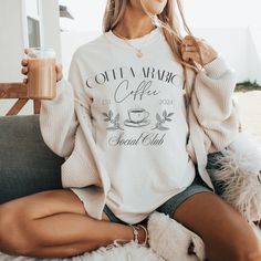 Calling all Coffee Connoisseurs and Coffee Break Champs! ☕️ Is your blood type basically espresso? Do you speak fluent "French Press, please"? Then you NEED this comfy-cute tee to rep your love for the magical bean! This isn't your average joe (pun intended) t-shirt. It's a badge of honor for the Coffea Arabica Social Club aka the original Coffee origin, the coolest club around (because, well, coffee fuels everything awesome). Made with ridiculously soft, 100% US cotton (ethically sourced, of course this tee is like getting a hug from your favorite coffee shop. Plus, it comes in 15 amazing colors to match your daily caffeine mood. Feeling bold? Rock a fiery red. Need a chill vibe? We've got calming blues and greens. *Super soft and comfy medium weight fabric (6.1 oz/yd²) *Relaxed fit for c Social Club T Shirt, Casual Coffee Crew Neck T-shirt, Fluent French, Coffee Social, Coffee Crew Neck Graphic T-shirt, Relaxed Fit Coffee T-shirt With Graphic Print, Coffee T Shirt, Coffee Crew Neck T-shirt With Text Print, Coffee T-shirt With Funny Print And Relaxed Fit