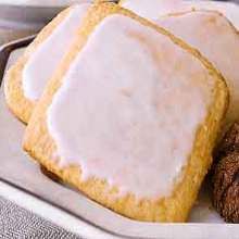 some cookies are sitting on a plate with icing