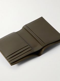 This SAINT LAURENT wallet offers a sophisticated solution to keep cards and cash organised. Crafted from supple leather, it has a convenient bifold construction with five card slots and space for cash or receipts. It's finished with a foiled logo on the front. Bifold Wallet Men, Saint Laurent Wallet, Men Logo, Leather Billfold, Wallet For Men, Billfold Wallet, Clip Wallet, Leather Bifold Wallet, Money Clip Wallet