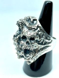 Jewel made entirely by hand by the Italian craftsman Gianmarco Fontana. Ring made of 925 Silver, which is part of the "SKULLS" collection depicting Paranoia. This ring represents the transformation and progression of Paranoia. Psychosis characterized by the development of a chronic, coherent delusion, which evolves slowly, leaving the remaining psychic functions intact. Unique Silver Skull Ring Collectible, Artisan Rings Stamped 925 For Collectors, Handmade Silver Skull Ring, Symbolic Style, Handmade Symbolic Silver Skull Ring, Handmade Silver Symbolic Skull Ring, Handmade Silver Skull Ring, Artisan Sterling Silver Ring For Collectors, Handmade Open Sterling Silver Skull Ring, Handmade Symbolic Sterling Silver Skull Ring