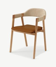 a wooden chair with a tan seat and back cushion on top of the armrests