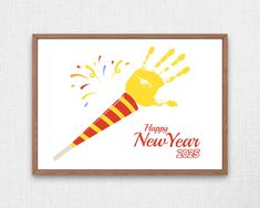 a happy new year card with a handprinted rocket on it and fireworks in the background