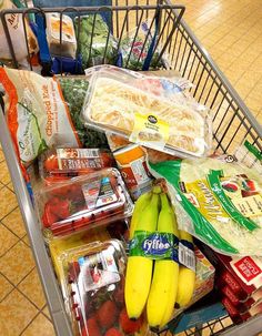 a shopping cart filled with lots of food