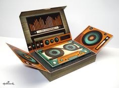 an old fashioned record player in a box with sound equals on it's side