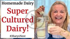 a woman holding up a sign that reads, super cultured dairy marynest