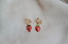 These red strawberry clip on earrings are a perfectly fun accessory to any outfit. These are make great gifts and party favors! Soft gold colored clips! Strawberry Clip On Earrings, Girls Clips, Fruit Earrings, Gold Clips, Red Strawberry, Gift For Girls, Flower Clip, Kawaii Clothes, Gifts For Girls