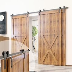 an open sliding door in a living room with wood paneling and metal hardware on the doors