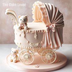 a baby carriage cake with a teddy bear on top