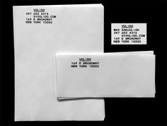 two white envelopes with labels on them