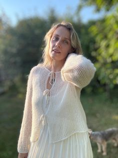 Sink into the cozy comfort of this luxurious oversized cardigan. Hand knitted from ultra-soft yarn, this chunky knit is perfect for cool days and cozy nights. The relaxed fit and chic design make it a versatile addition to your wardrobe and the perfect complement to your favorite outfits for effortless elegance. Ideal as a gift for the person you want to give warmth and comfort!! look at the photo of flowers and choose which one you like. The color plate is shown in the photo the cardigan model in the photo is made in color 10 The buttons for this cardigan will be selected based on the main color you selected when ordering. If you want to add contrasting buttons that are different from the main color, please let me know. 💜Materials:  Made from high quality, super soft yarn for comfort and Mohair Cardigan For Layering, Bohemian Soft Knit Sweater, Beige Mohair Sweater, Soft Knit Mohair Cardigan, Cream Bohemian Sweater, Wedding Cardigan, Mohair Sweater Knit, Color Plate, Knitted Jacket