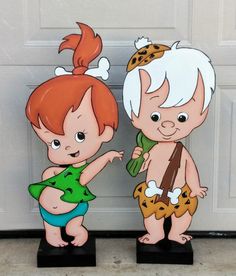 two cartoon figurines are standing next to each other in front of a garage door