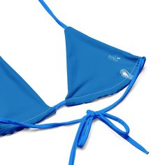 Stay comfortable and beach ready all summer in this FYC String Bikini set. It’s made from soft recycled polyester with double-layering and UPF 50+. Style the straps how you like, and get ready to swim! • Soft and stretchy material with UPF 50+ • Sizes up to 4XL • Bikini top comes with removable padding for comfort • Multiple ways to tie and style the bikini set Disclaimer: To make your All-Over Print Recycled String Bikini last longer, thoroughly rinse it off after each use and get rid of any ch