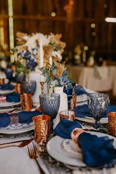 the table is set with blue and white dishes