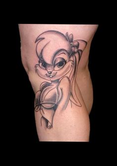 a woman's thigh with an image of a cartoon character on it and the word disney written in black ink